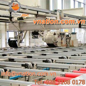 materials handling clamp with conveyor system