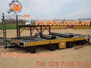 flatbed trailer / 4-axle / for industrial materials / hydraulic