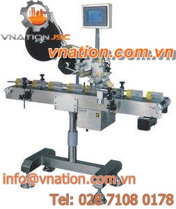 automatic labelling machine / top / for self-adhesive labels / food