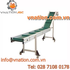belt conveyor / inclined / transport / for packaging lines
