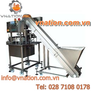solids dispenser / volumetric / automatic / with belt feeder