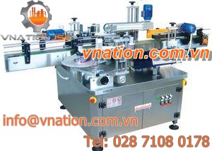 double-sided labelling machine / for self-adhesive labels / glass bottle / for plastic bottles