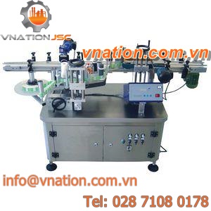 self-adhesive label labelling machine / glass bottle / wrap-around / for plastic bottles