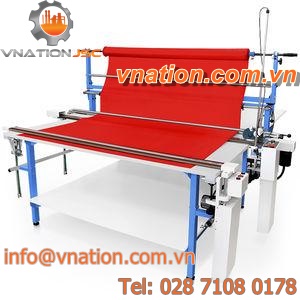 cutting table with spreading machine / for textiles