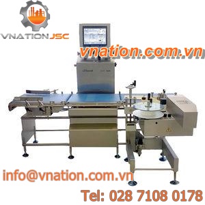 front labeler / side / in-line / for cardboard box