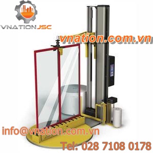 turntable stretch wrapping machine / vertical / automatic / with conveyor