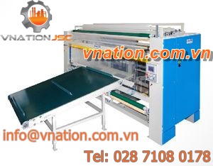 rotary packaging machine / continuous-motion / for fabric roll / for the textile industry