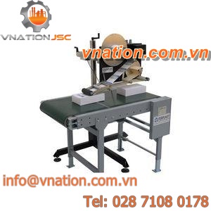 linear labelling machine / for self-adhesive labels / for cardboard box / high-speed