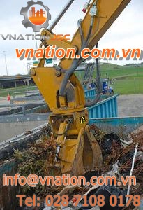 waste handling and tamping grapple