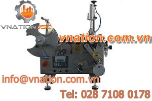 back labeler / in-line / for cylindrical products / semi-automatic