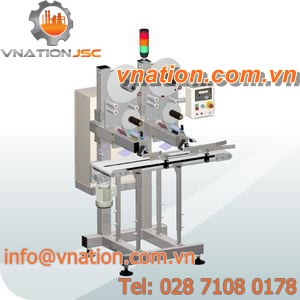 automatic labeler / top / for self-adhesive labels / linear
