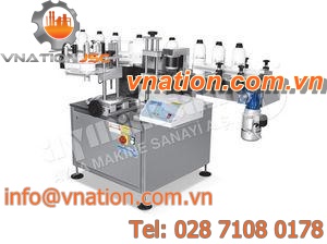 top labeler / in-line / for cylindrical products / automatic
