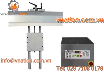 automatic heat sealer / vertical / ferromagnetic / cap