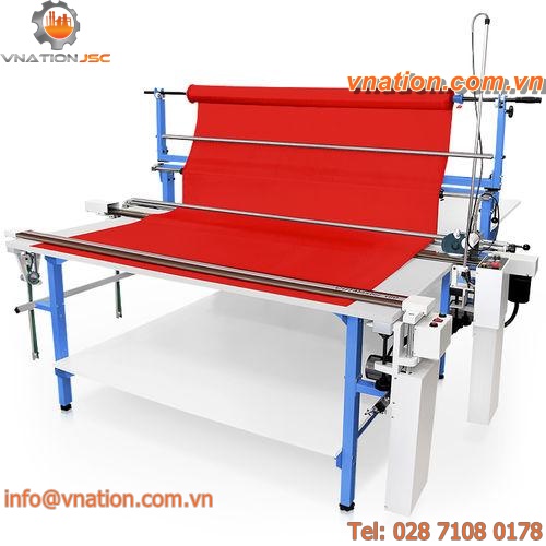 cutting table with spreading machine / for textiles