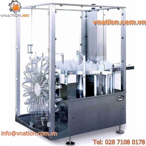 dry cleaning machine / vertical / continuous / aspiration