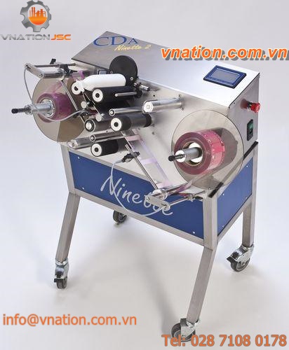 side labeler / in-line / for self-adhesive labels / for cylindrical products