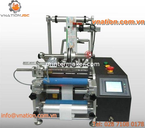 double-sided labelling machine / rotary / for cylindrical products / for the food and beverage industry